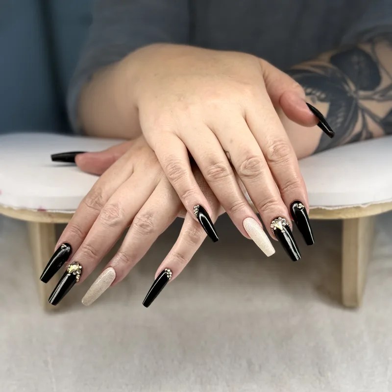 Long coffin-shaped nails in glossy black and white.