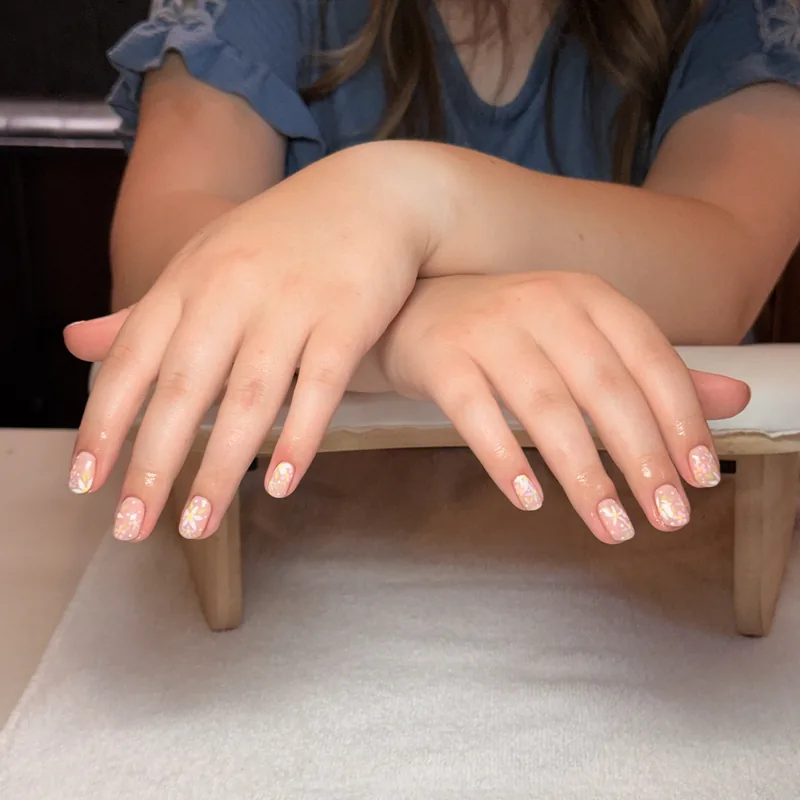 Short almond nails in a sheer milky nude.